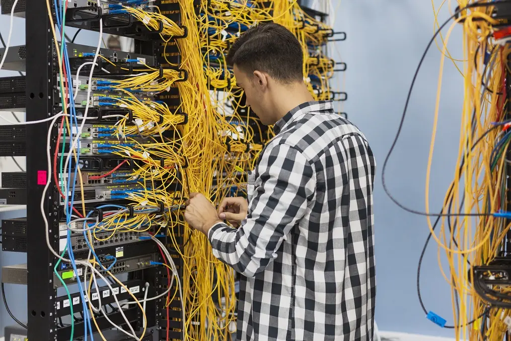man-working-ethernet-switch